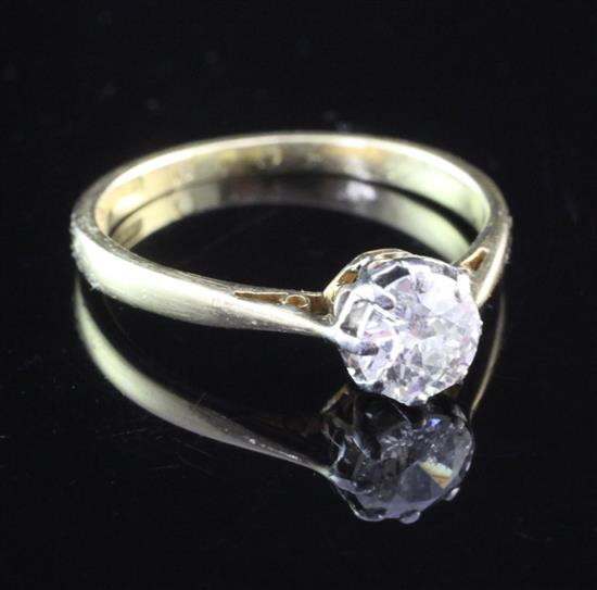 An 18ct gold and solitaire diamond ring, size M.